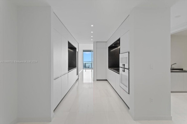 kitchen with sink and white cabinetry