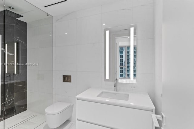 bathroom with vanity, tile walls, toilet, and tiled shower