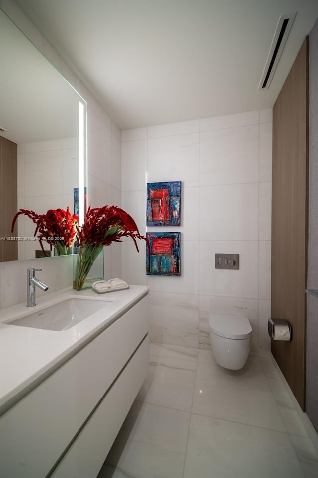 300 Biscayne Blvd Way Unit 3403, Miami, FL 33131 - bathroom featuring vanity, tile walls, toilet, and marble finish flooring