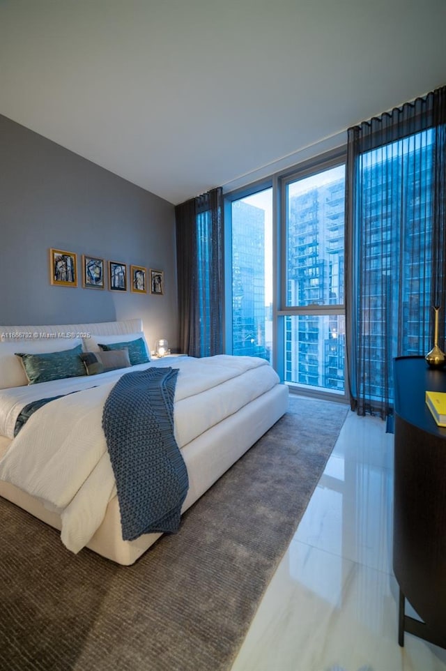 300 Biscayne Blvd Way Unit 3403, Miami, FL 33131 - bedroom with expansive windows and marble finish flooring