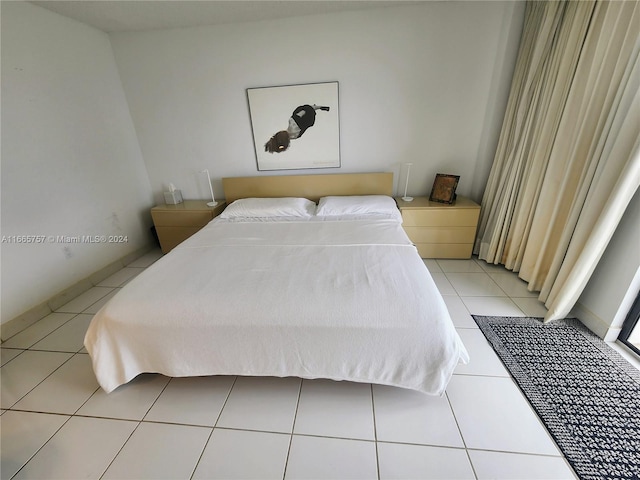 bedroom featuring light tile patterned flooring