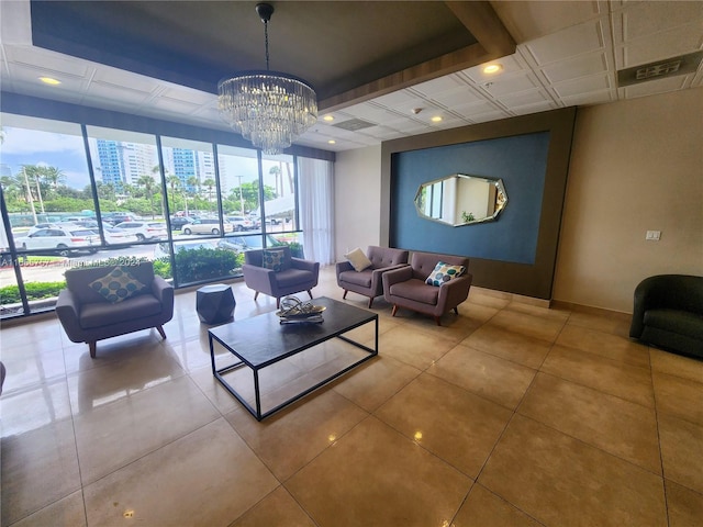 tiled living room featuring a chandelier