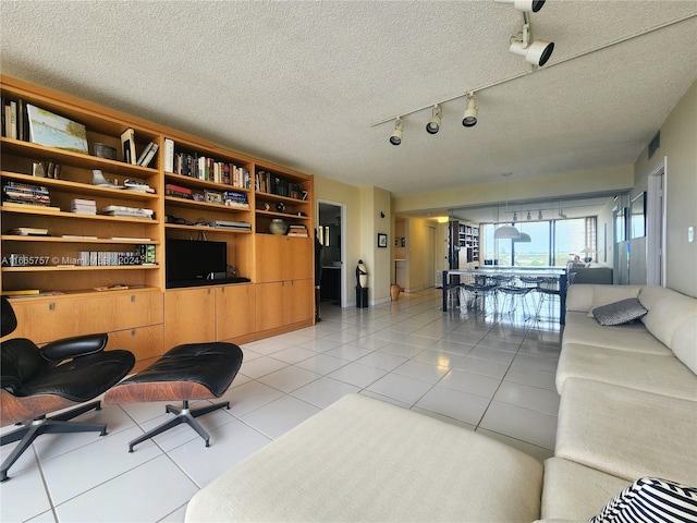 tiled living room with a textured ceiling