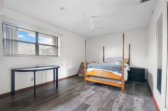 bedroom with ceiling fan, a textured ceiling, and hardwood / wood-style floors