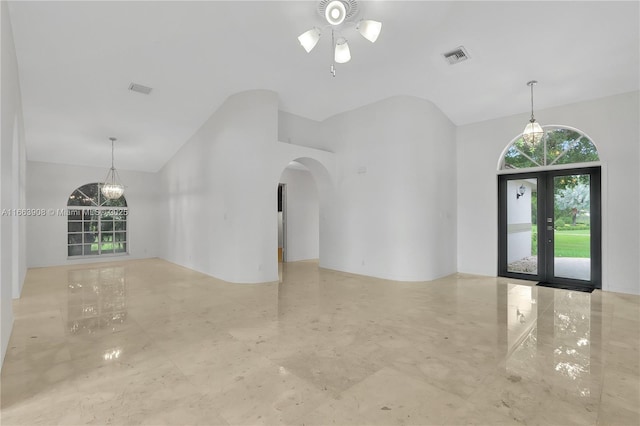 interior space featuring french doors and a high ceiling