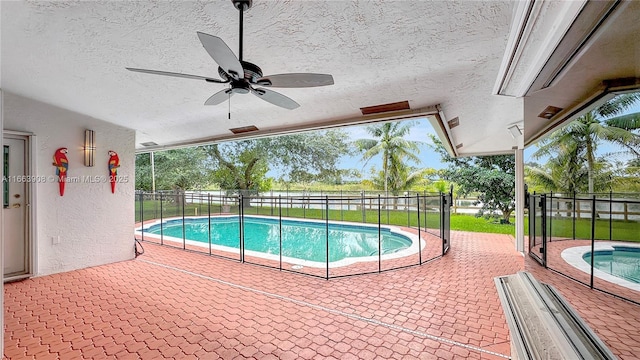 view of pool featuring ceiling fan and a patio