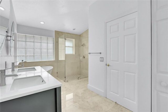 bathroom with vanity and a shower with shower door