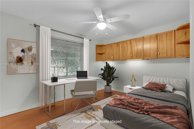 bedroom with wood-type flooring and ceiling fan