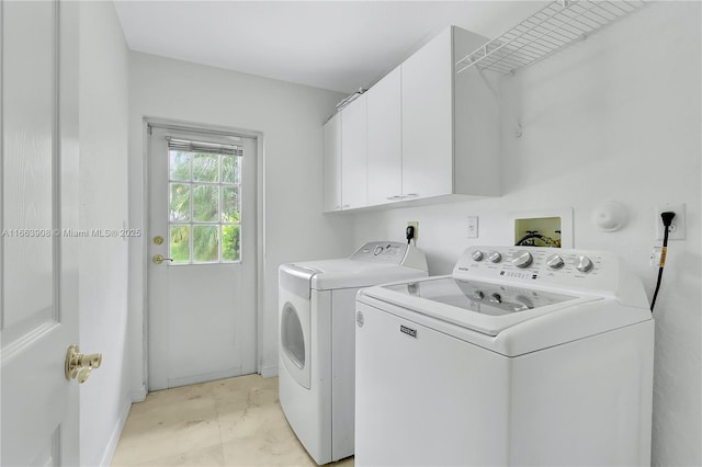 laundry room with cabinets and independent washer and dryer