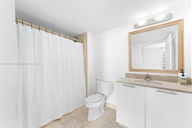 bathroom with vanity, toilet, and a shower with shower curtain