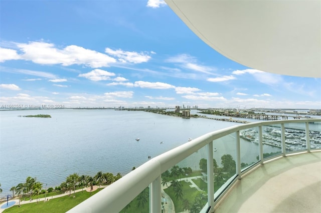 balcony featuring a water view