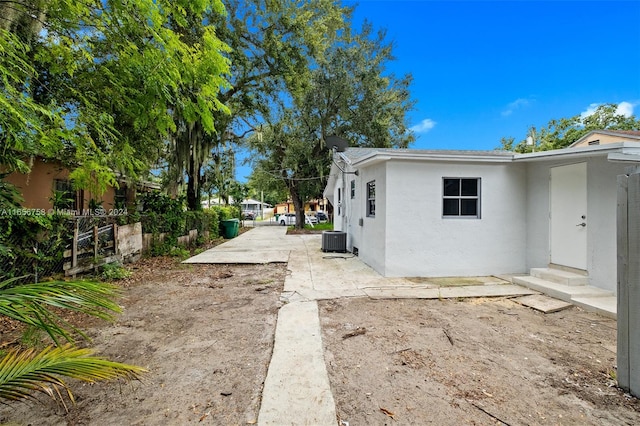 view of home's exterior featuring cooling unit and a patio area