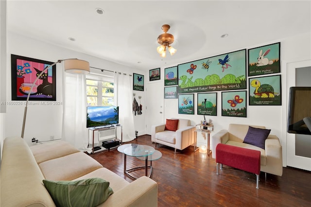 living room featuring hardwood / wood-style floors and ceiling fan