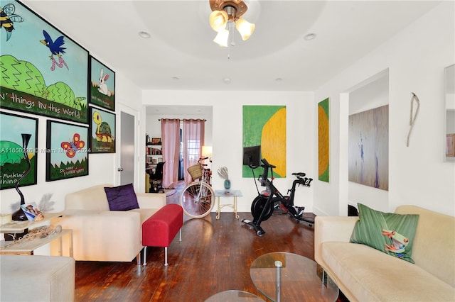 living room with hardwood / wood-style floors and ceiling fan