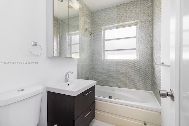 full bathroom featuring shower / bath combination with glass door, vanity, and toilet