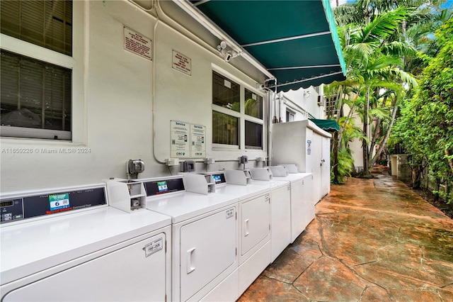 laundry area featuring washing machine and clothes dryer