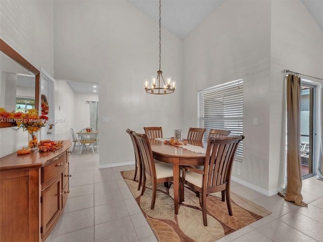 tiled dining room featuring a chandelier, high vaulted ceiling, and a healthy amount of sunlight