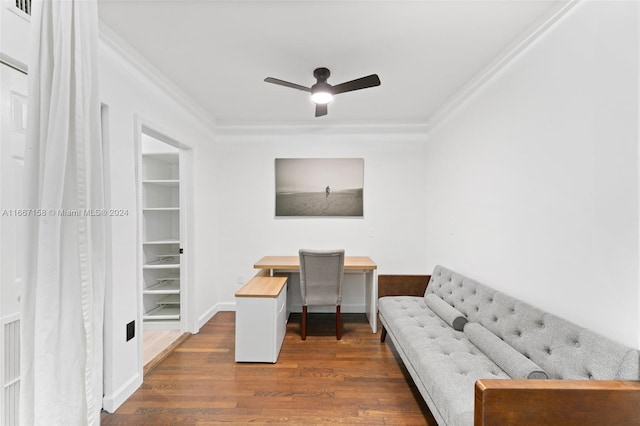 office with built in shelves, crown molding, ceiling fan, and dark hardwood / wood-style floors