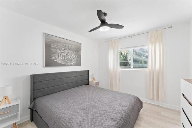 bedroom featuring ceiling fan and light hardwood / wood-style floors