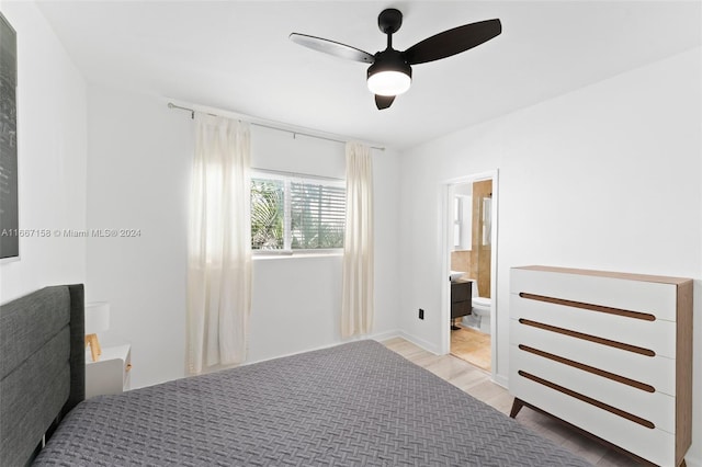 bedroom featuring light wood-type flooring, connected bathroom, and ceiling fan