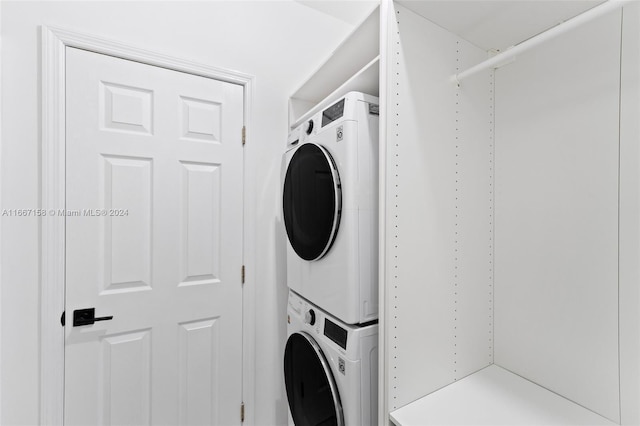 laundry room featuring stacked washer and dryer