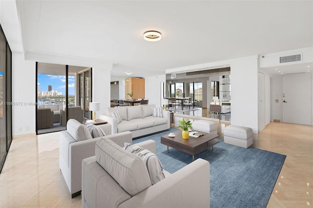 living room featuring plenty of natural light