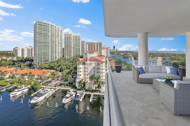 balcony featuring an outdoor hangout area and a water view