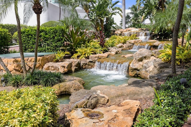 view of yard with a garden pond