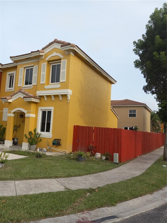 view of home's exterior with a yard