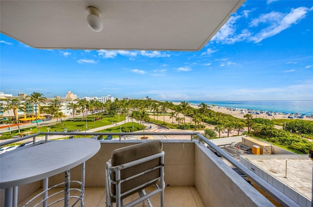 balcony with a beach view and a water view