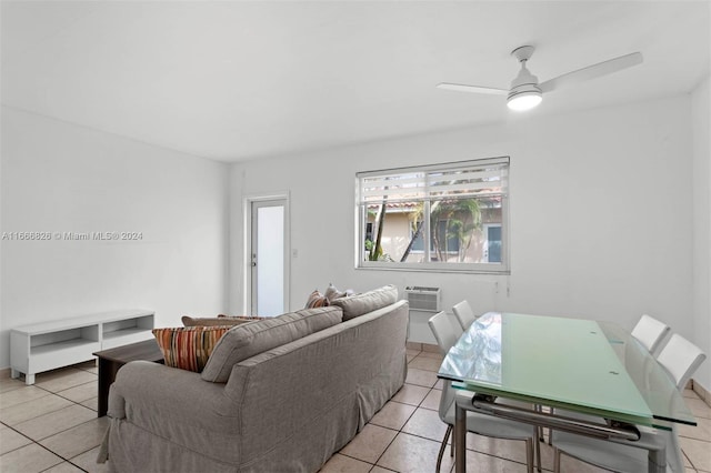 tiled living room with ceiling fan