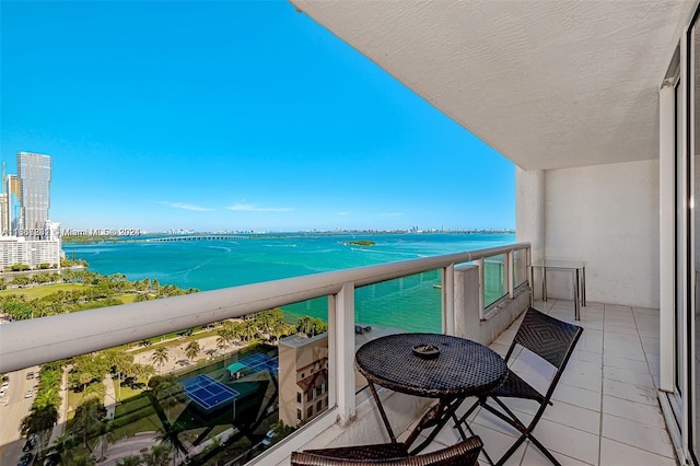 balcony featuring a water view