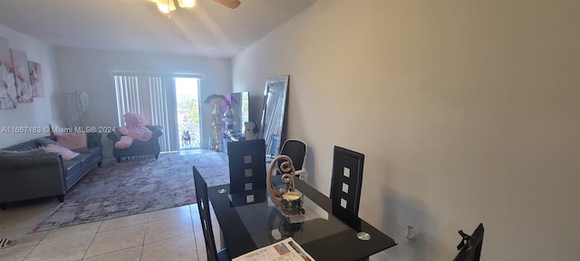 tiled dining area with ceiling fan