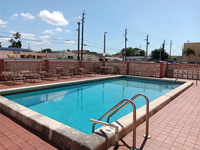 view of swimming pool with a patio