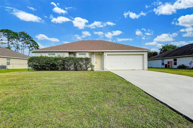 single story home with a garage and a front lawn