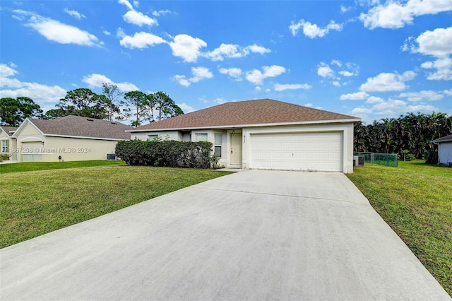 single story home featuring a front yard and a garage