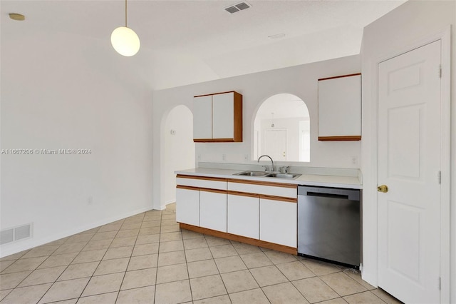 kitchen with white cabinets, dishwasher, light tile patterned floors, decorative light fixtures, and sink