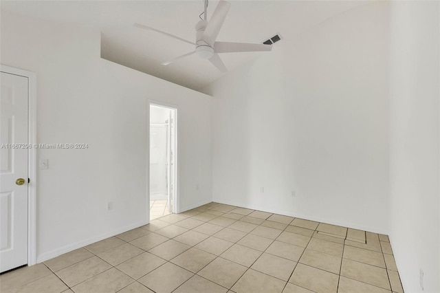 unfurnished room with ceiling fan and light tile patterned floors