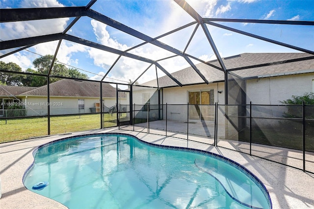 view of pool featuring a lanai, a patio, and a yard