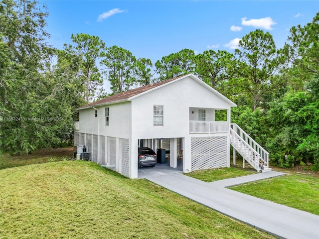 view of front facade featuring a front lawn and a carport