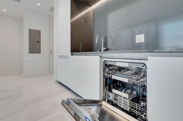 laundry room with electric panel and sink