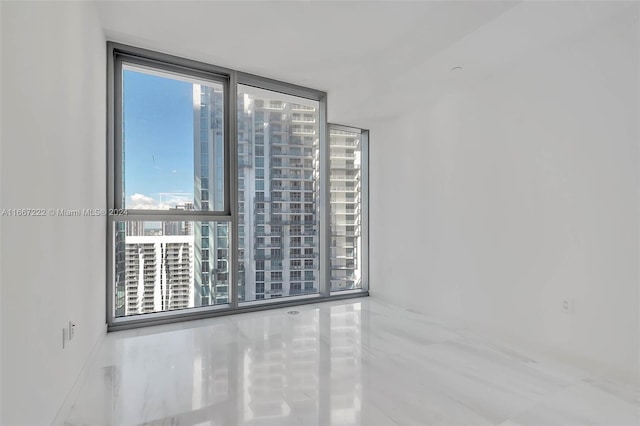 spare room with expansive windows