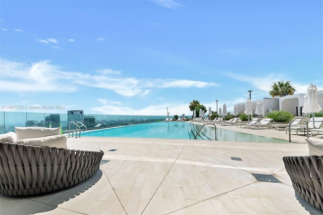 view of swimming pool with a patio