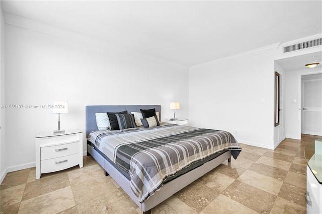 bedroom with ornamental molding