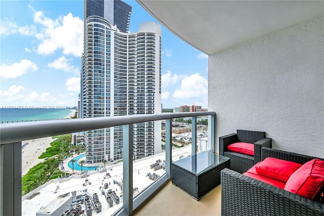 balcony featuring a water view