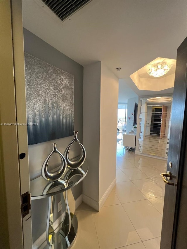 hallway featuring light tile patterned floors