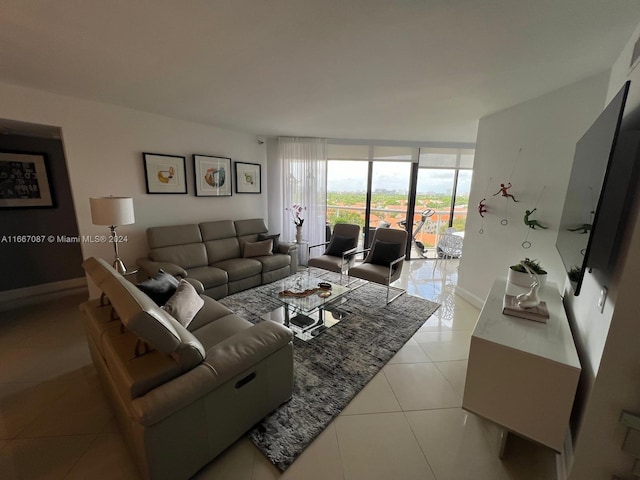 tiled living room featuring a wall of windows