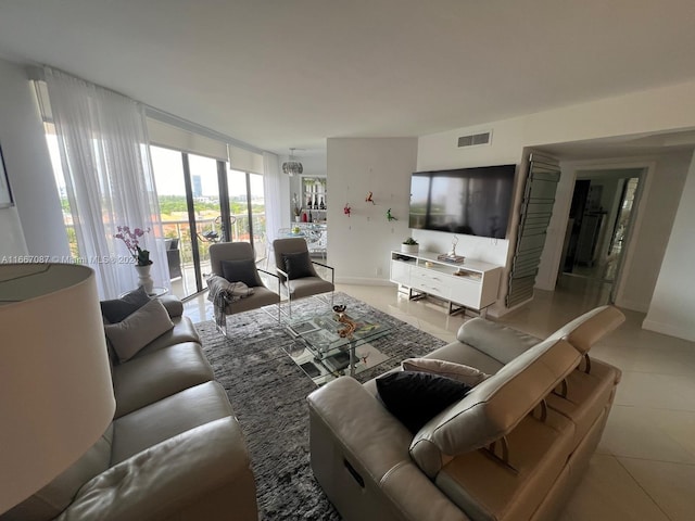 living room with french doors and light tile patterned floors