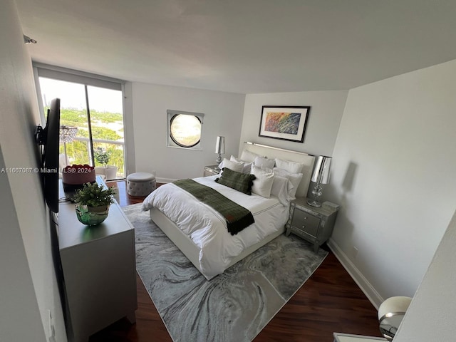 bedroom featuring dark hardwood / wood-style floors