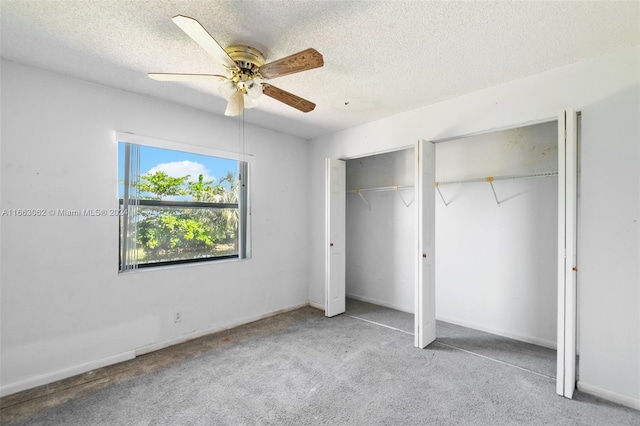 unfurnished bedroom featuring a textured ceiling, light carpet, and ceiling fan